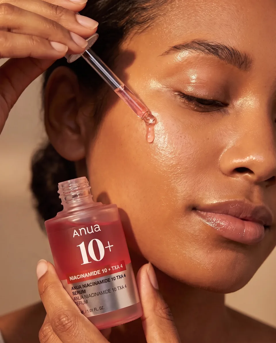 The finished campaign creative by Illume: the serum applied to the model's cheek